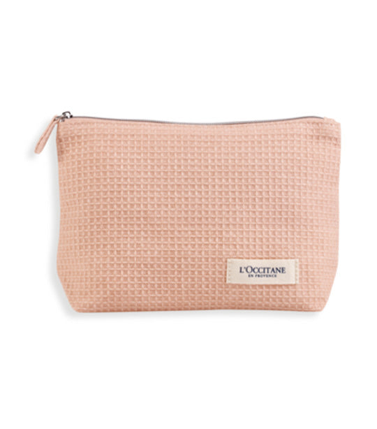 Complimentary L'Occitane Pouch, Reusable Face Wipes, a Shea Ultra Rich Body Cream 20ml, and Wisteria Hand Cream 10ml