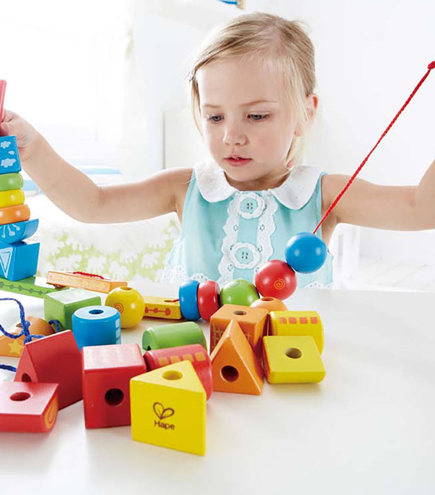 hape string along shapes